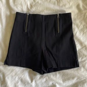 High waisted stretchy black shorts. Size 4.